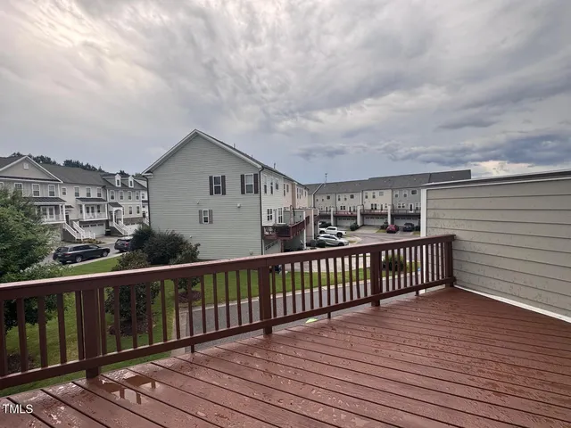 a view of a balcony with wooden floor