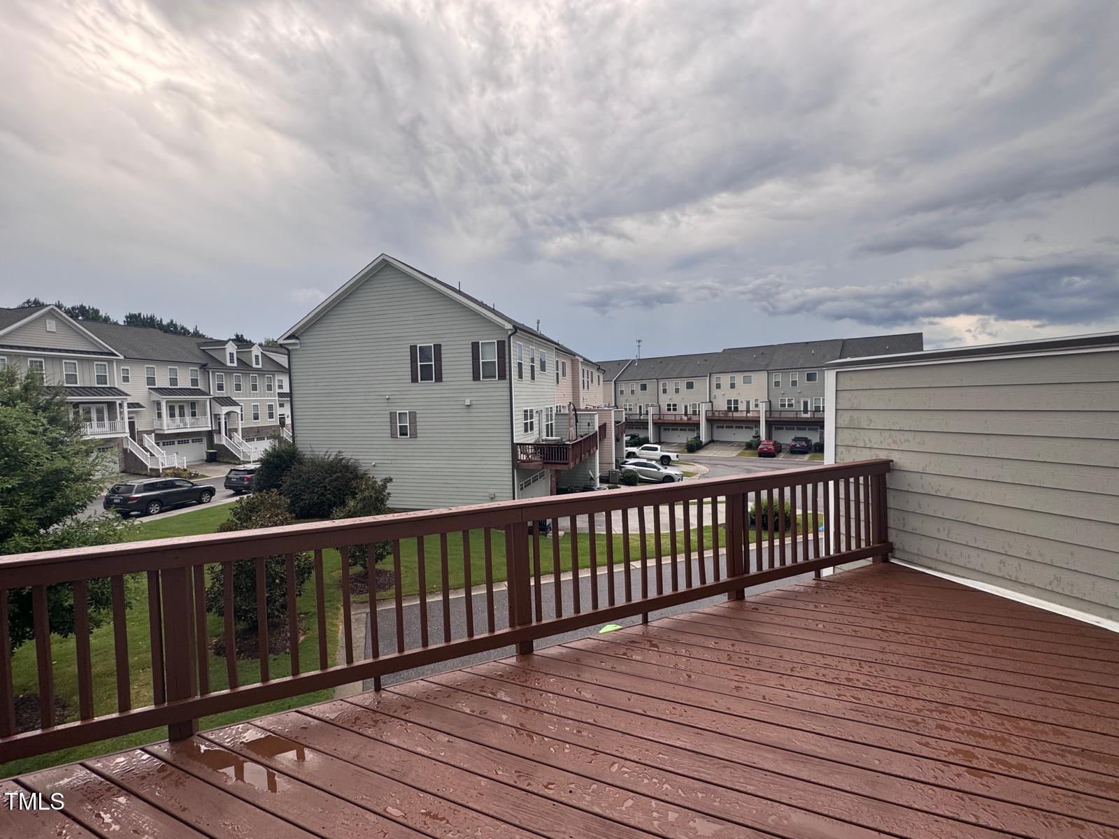 8008 Reedybrook Crossing Apex, NC 27523 - Photo 26 of 27 a view of a balcony with wooden floor