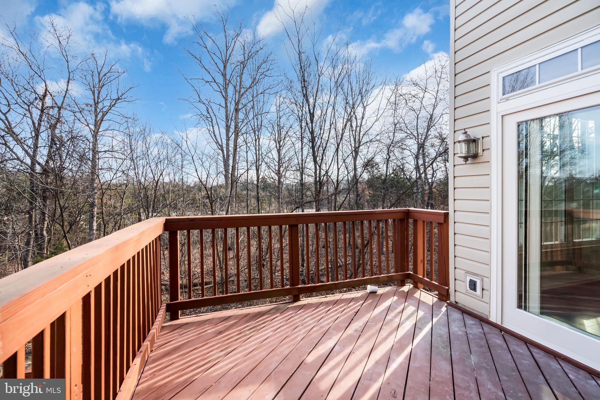21644 Frame Square Broadlands, VA 20148 - Photo 15 of 38 a view of balcony with wooden floor and fence