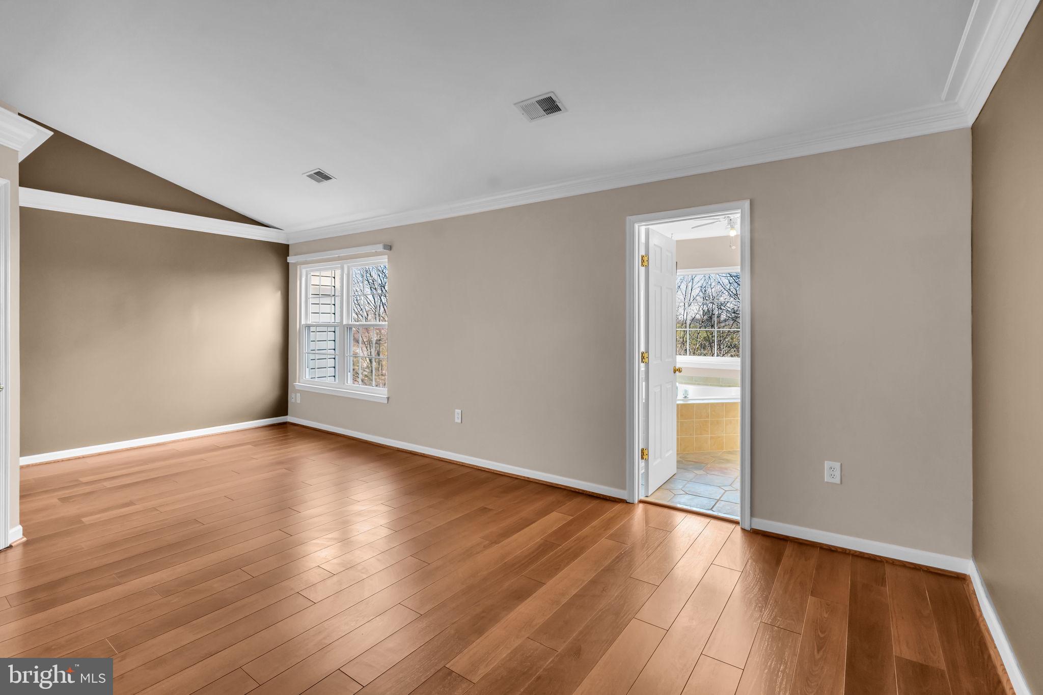 21644 Frame Square Broadlands, VA 20148 - Photo 18 of 38 a view of an empty room with wooden floor and a window