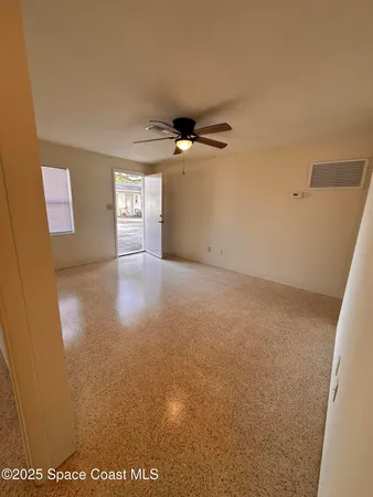 a view of a livingroom with a ceiling fan