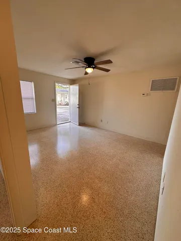 a view of a livingroom with a ceiling fan