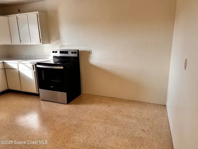 a kitchen with a stove and a microwave