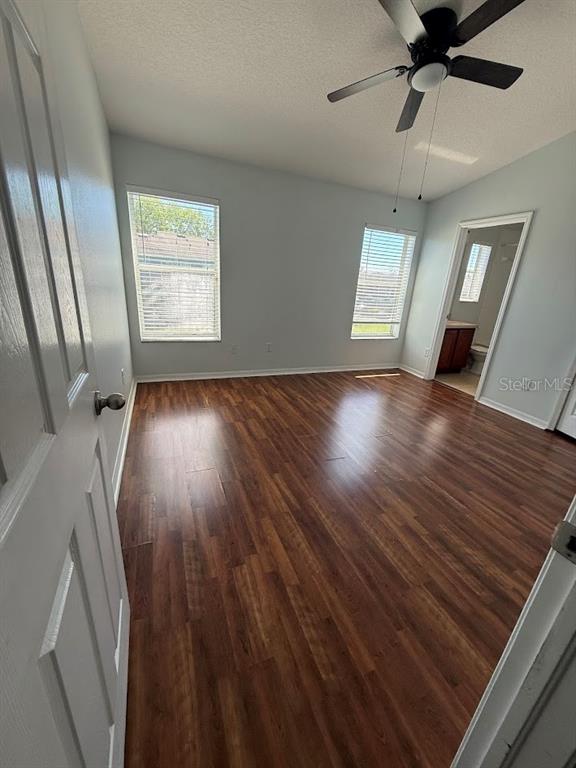 1567 Blue Magnolia Road Brandon, FL 33510 - Photo 17 of 23 wooden floor in an empty room with a window
