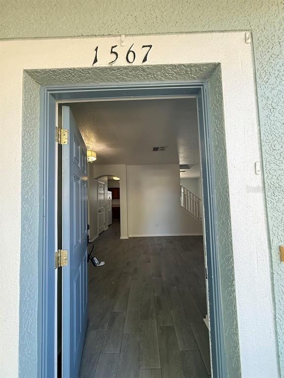 1567 Blue Magnolia Road Brandon, FL 33510 - Photo 2 of 23 a view of a hallway with wooden shelves