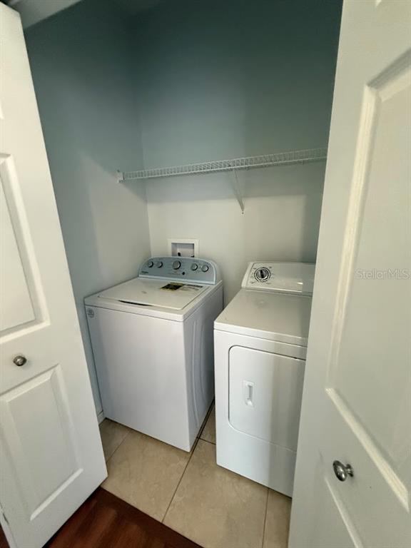 1567 Blue Magnolia Road Brandon, FL 33510 - Photo 21 of 23 a utility room with dryer and washer
