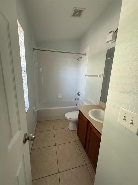 1567 Blue Magnolia Road Brandon, FL 33510 - Photo 23 of 23 a bathroom with a sink a toilet and shower