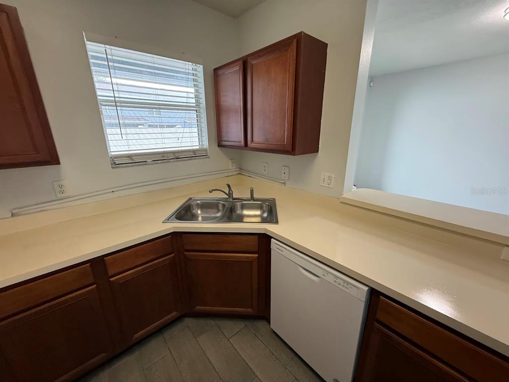 1567 Blue Magnolia Road Brandon, FL 33510 - Photo 10 of 23 a kitchen with a sink and cabinets