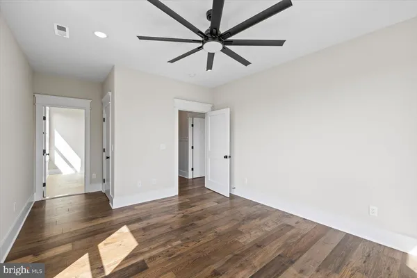 a view of a balcony with wooden floor