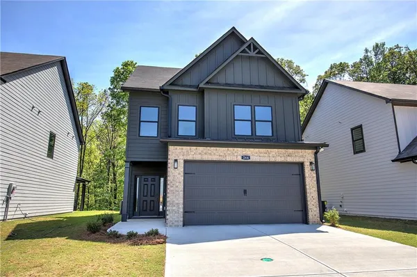 a front view of a house with a garage