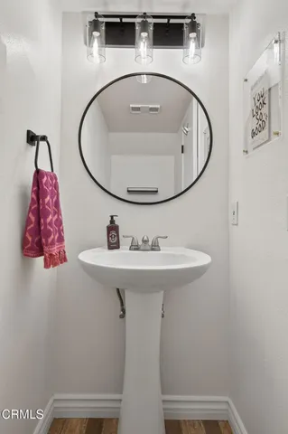 a bathroom with a sink and mirror