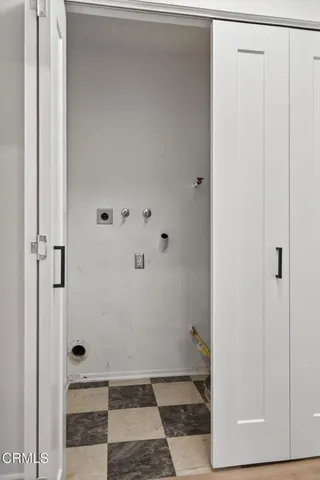a bathroom with a glass door shower