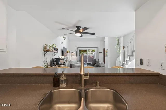 a kitchen with a sink and a refrigerator