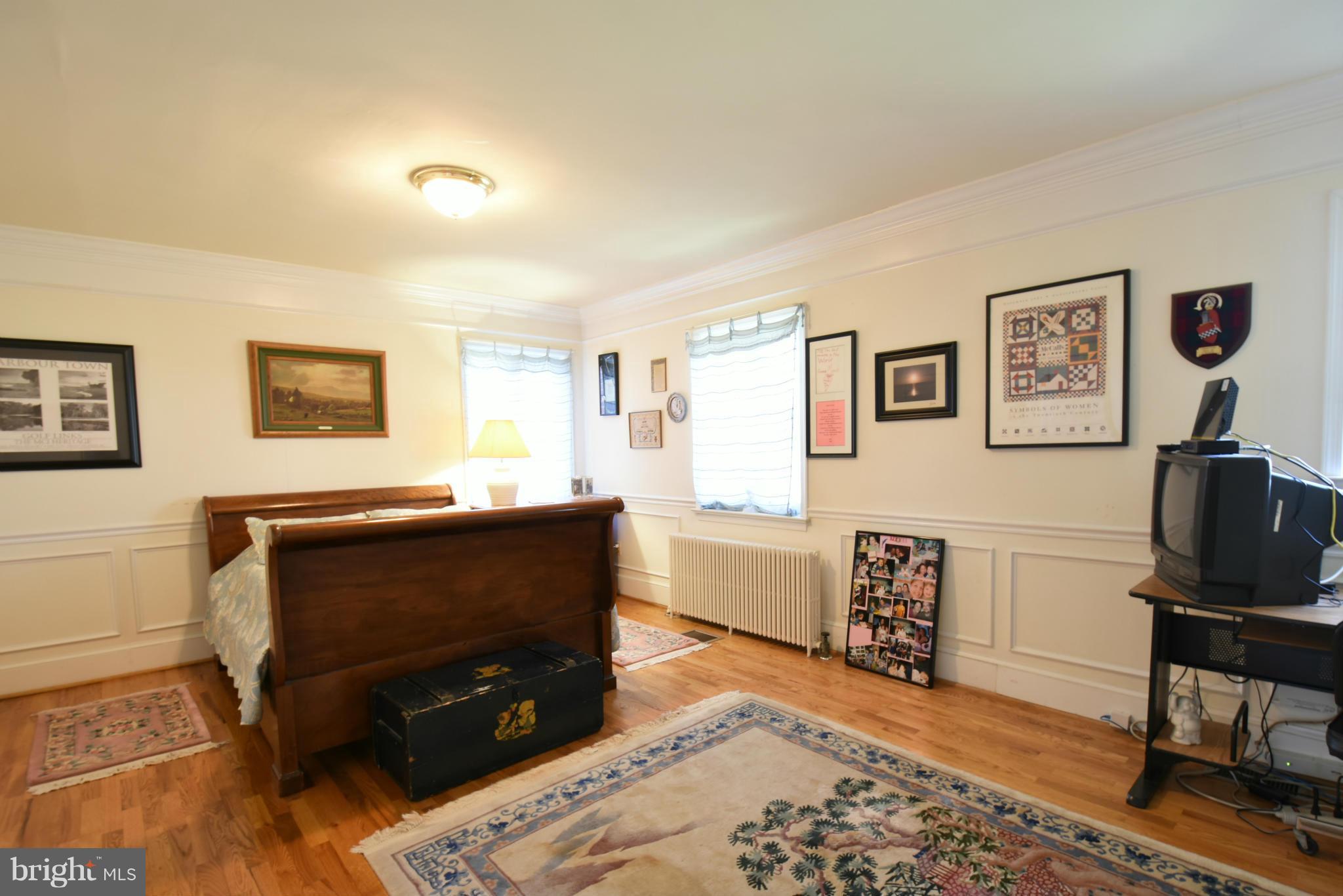 5911 Chesterbrook Road McLean, VA 22101 - Photo 13 of 28 a living room with furniture and a flat screen tv