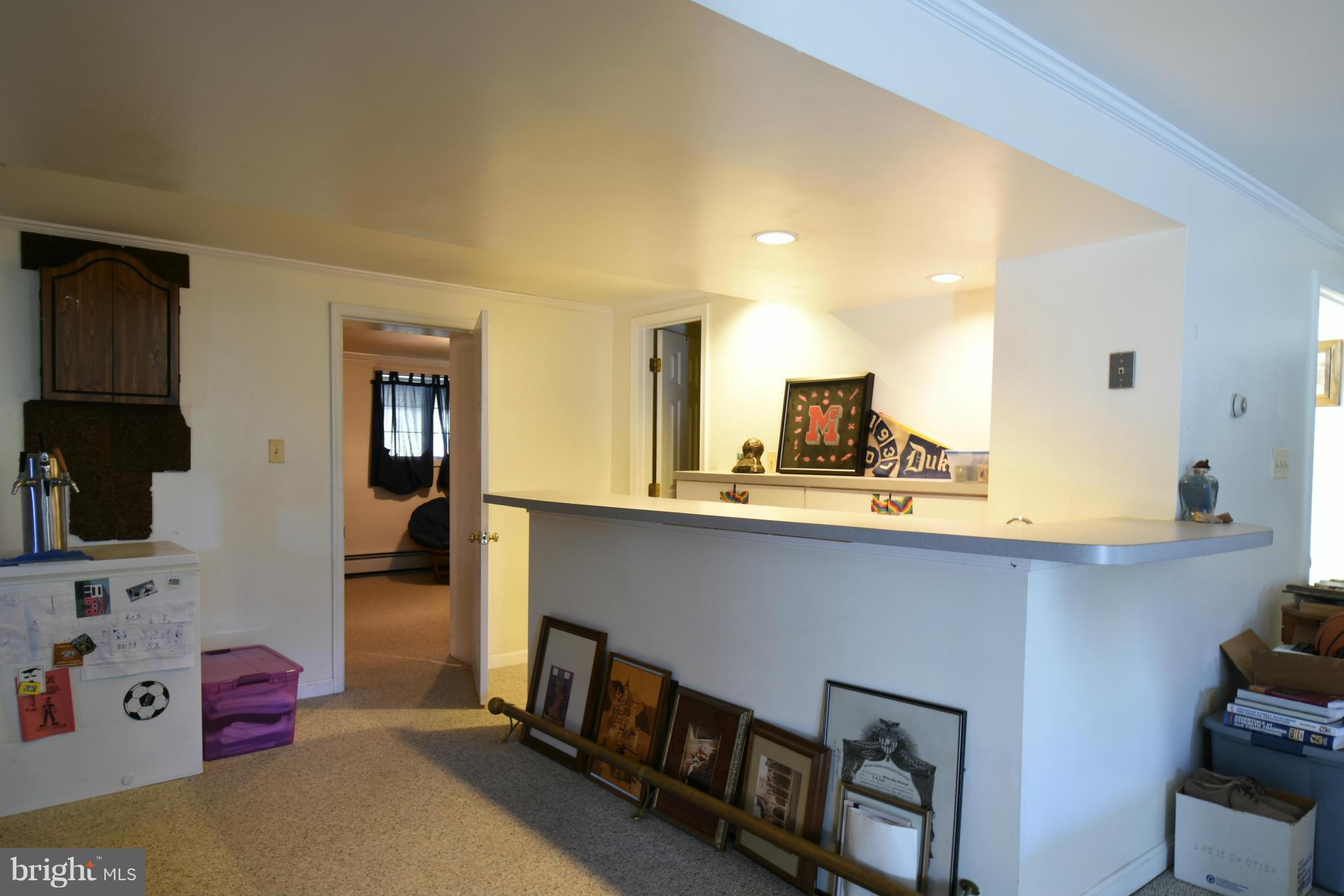 5911 Chesterbrook Road McLean, VA 22101 - Photo 20 of 28 a kitchen with kitchen island a sink appliances and cabinets