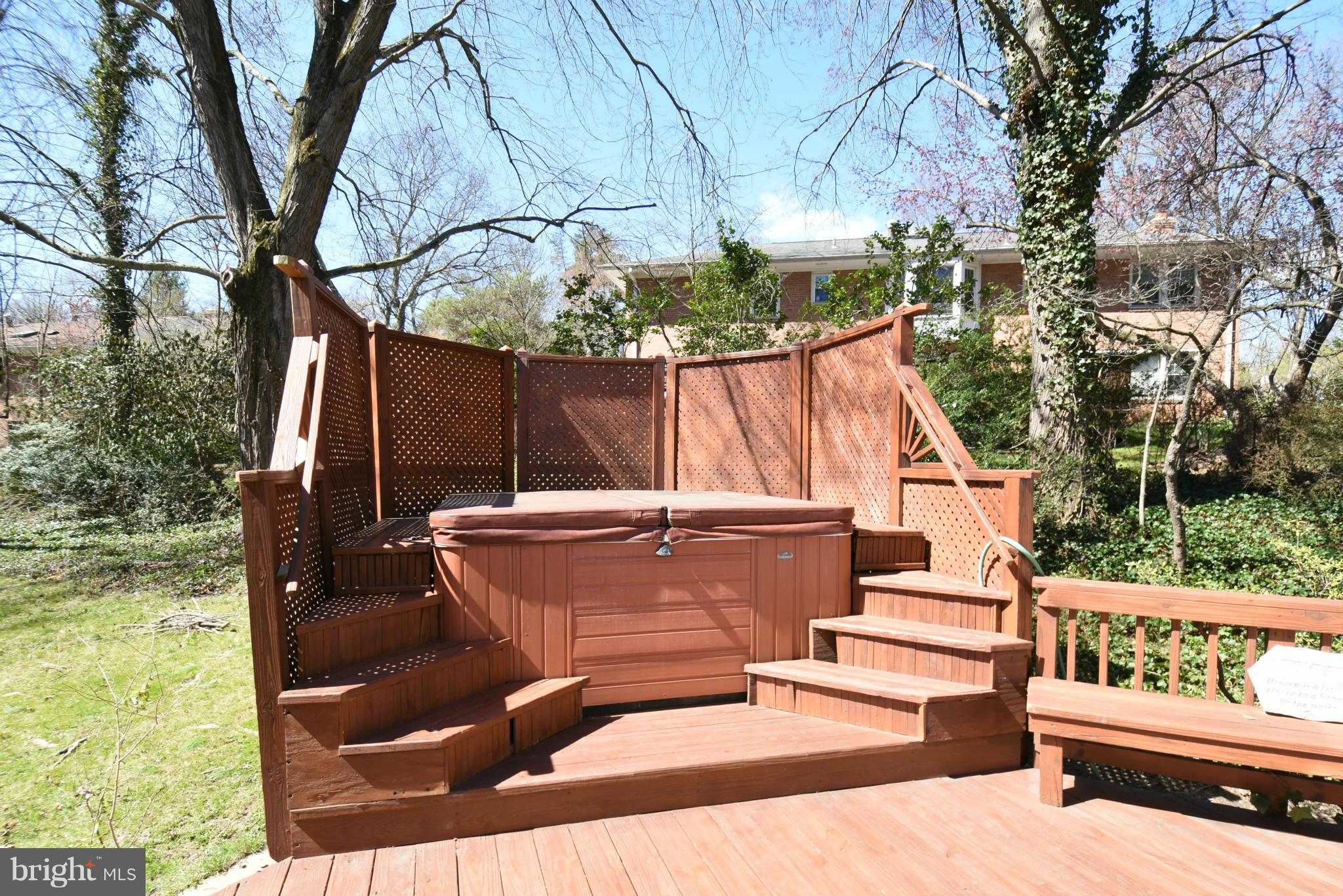 5911 Chesterbrook Road McLean, VA 22101 - Photo 23 of 28 a view of backyard with roof deck and wooden fence