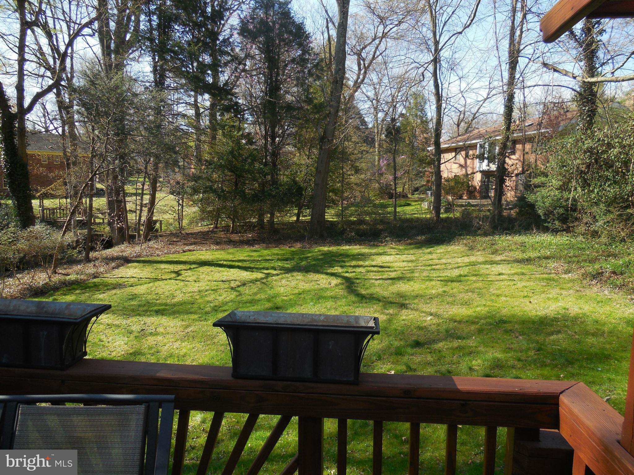 5911 Chesterbrook Road McLean, VA 22101 - Photo 25 of 28 a view of a yard with wooden deck