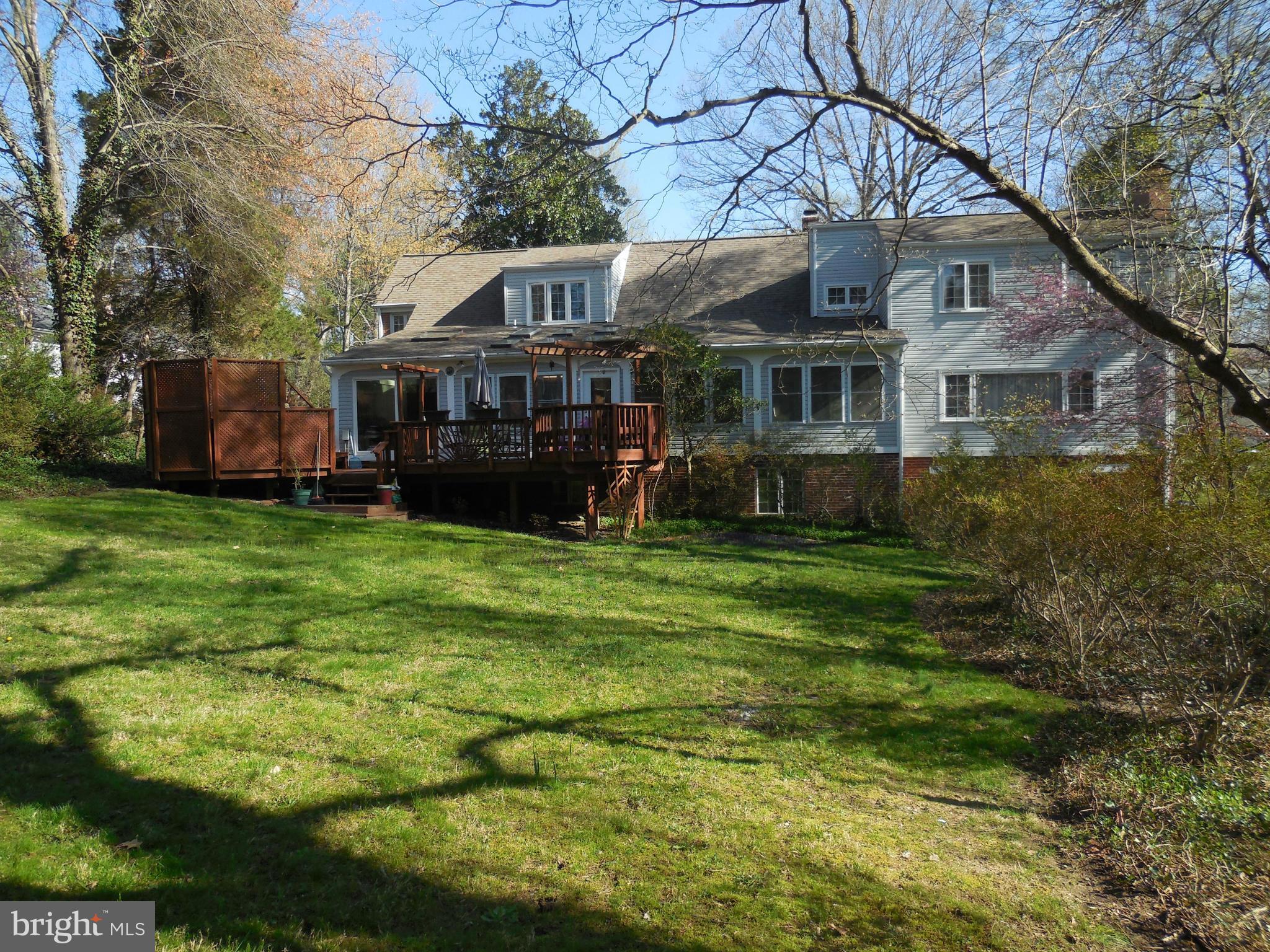 5911 Chesterbrook Road McLean, VA 22101 - Photo 27 of 28 a view of house with a big yard