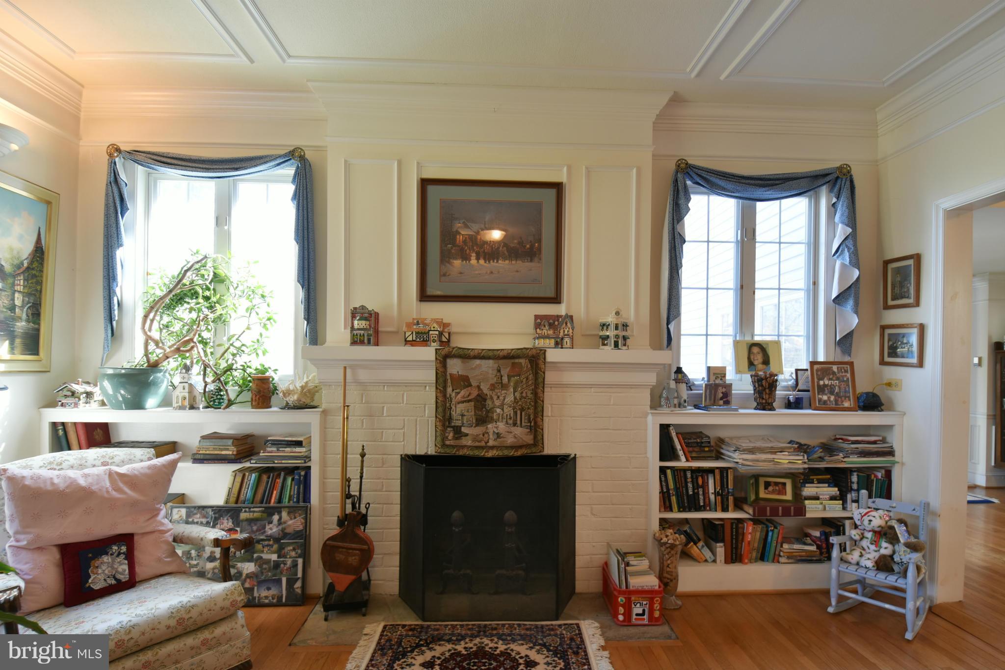 5911 Chesterbrook Road McLean, VA 22101 - Photo 4 of 28 a living room with fireplace furniture and a window