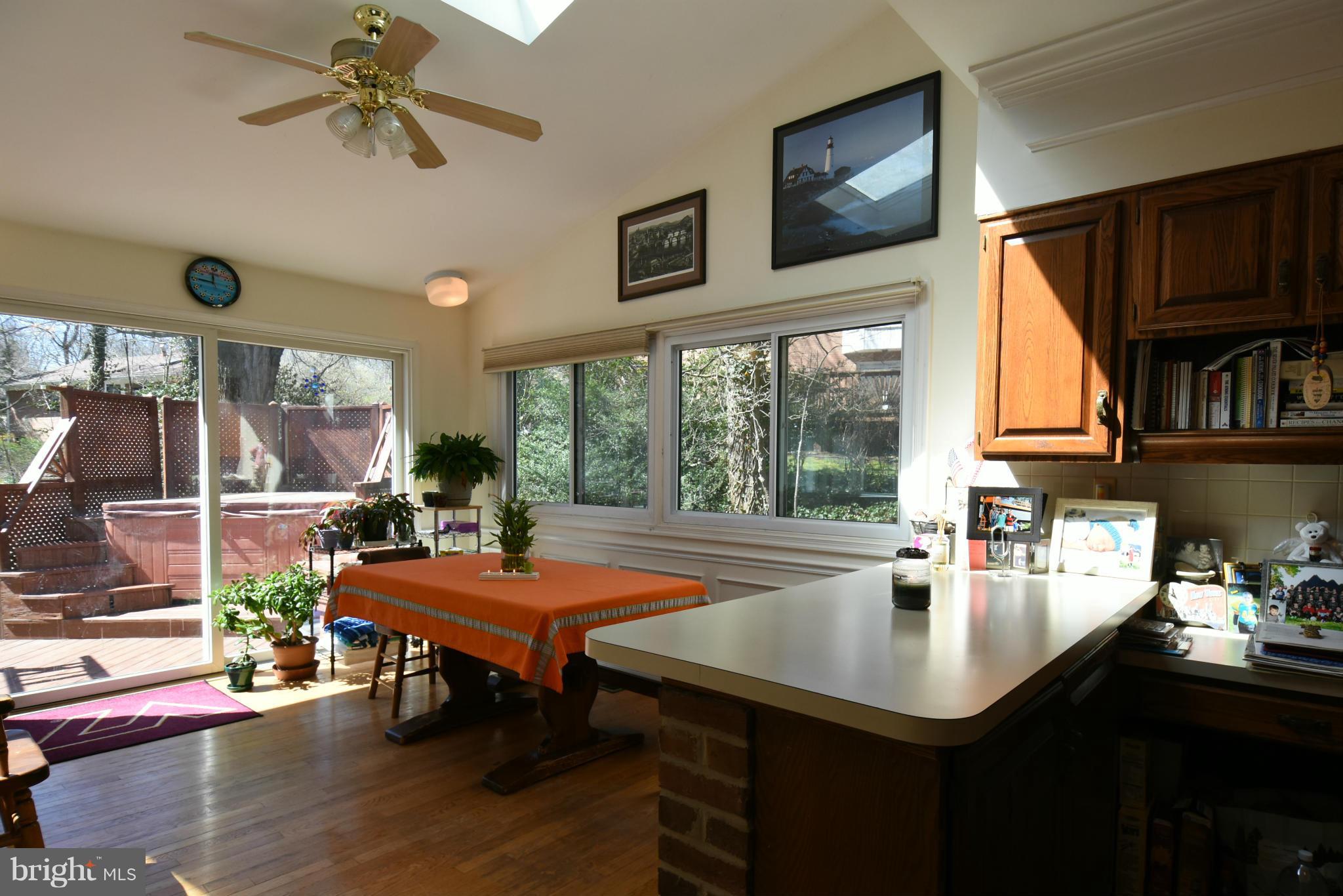 5911 Chesterbrook Road McLean, VA 22101 - Photo 8 of 28 a table and chairs in front of a room with wooden floor