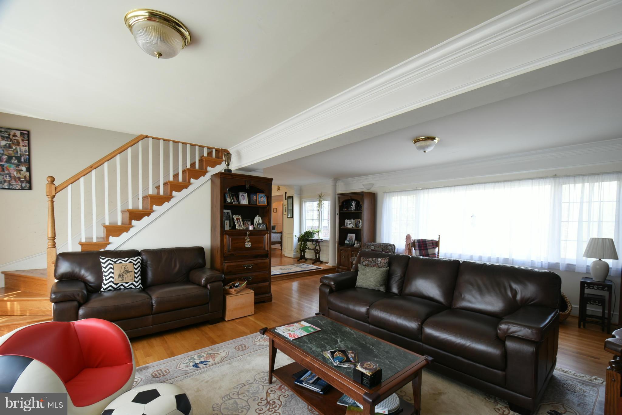 5911 Chesterbrook Road McLean, VA 22101 - Photo 10 of 28 a living room with furniture a rug and a window