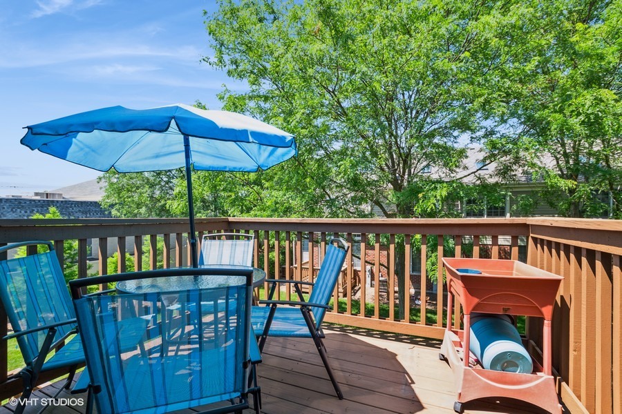 13350 Forest Ridge Drive, Unit 2 Palos Heights, IL 60463 - Photo 12 of 13 a view of a wooden deck with furniture