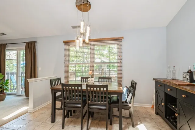 a view of a dining room with furniture window and outside view