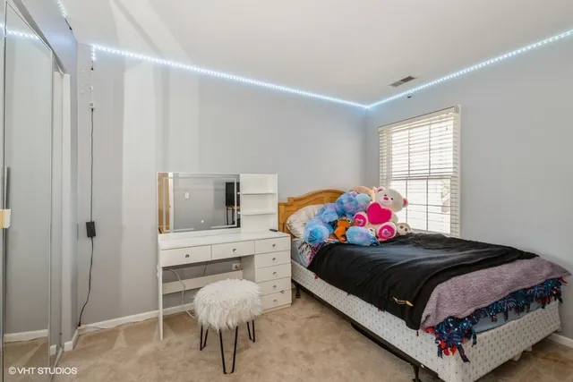 a bedroom with a bed and window