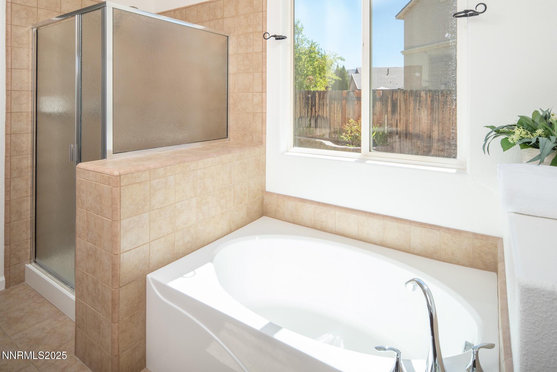 2085 Long Hollow Drive Reno, NV 89521 - Photo 17 of 42 a en suite bathroom with a tub and shower