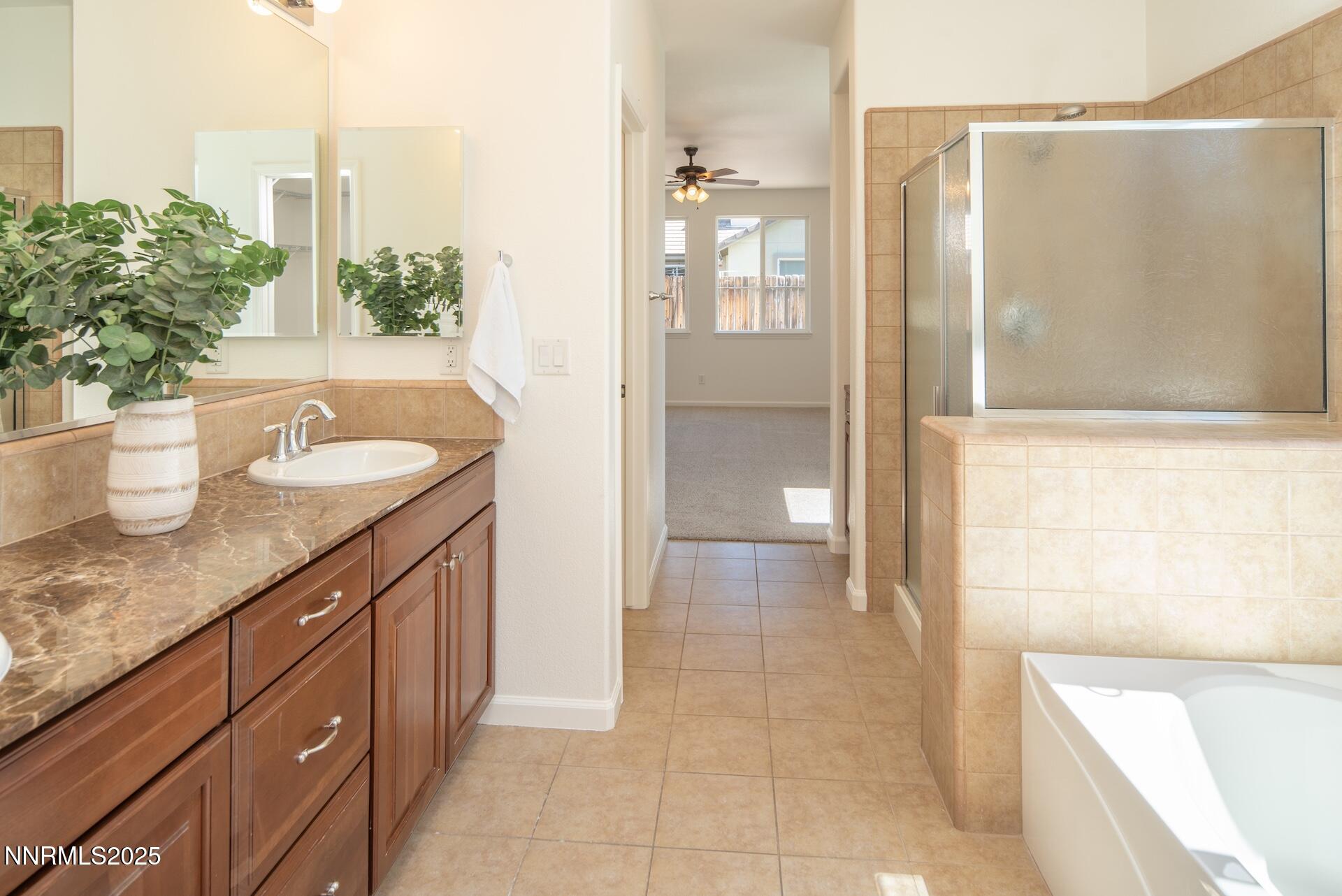2085 Long Hollow Drive Reno, NV 89521 - Photo 18 of 42 a spacious bathroom with a granite countertop sink a toilet and shower