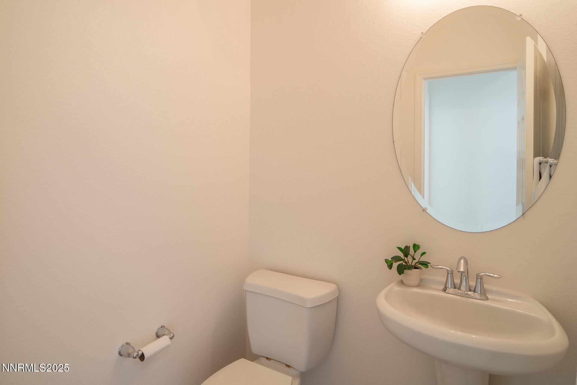 2085 Long Hollow Drive Reno, NV 89521 - Photo 22 of 42 a bathroom with a toilet sink and mirror
