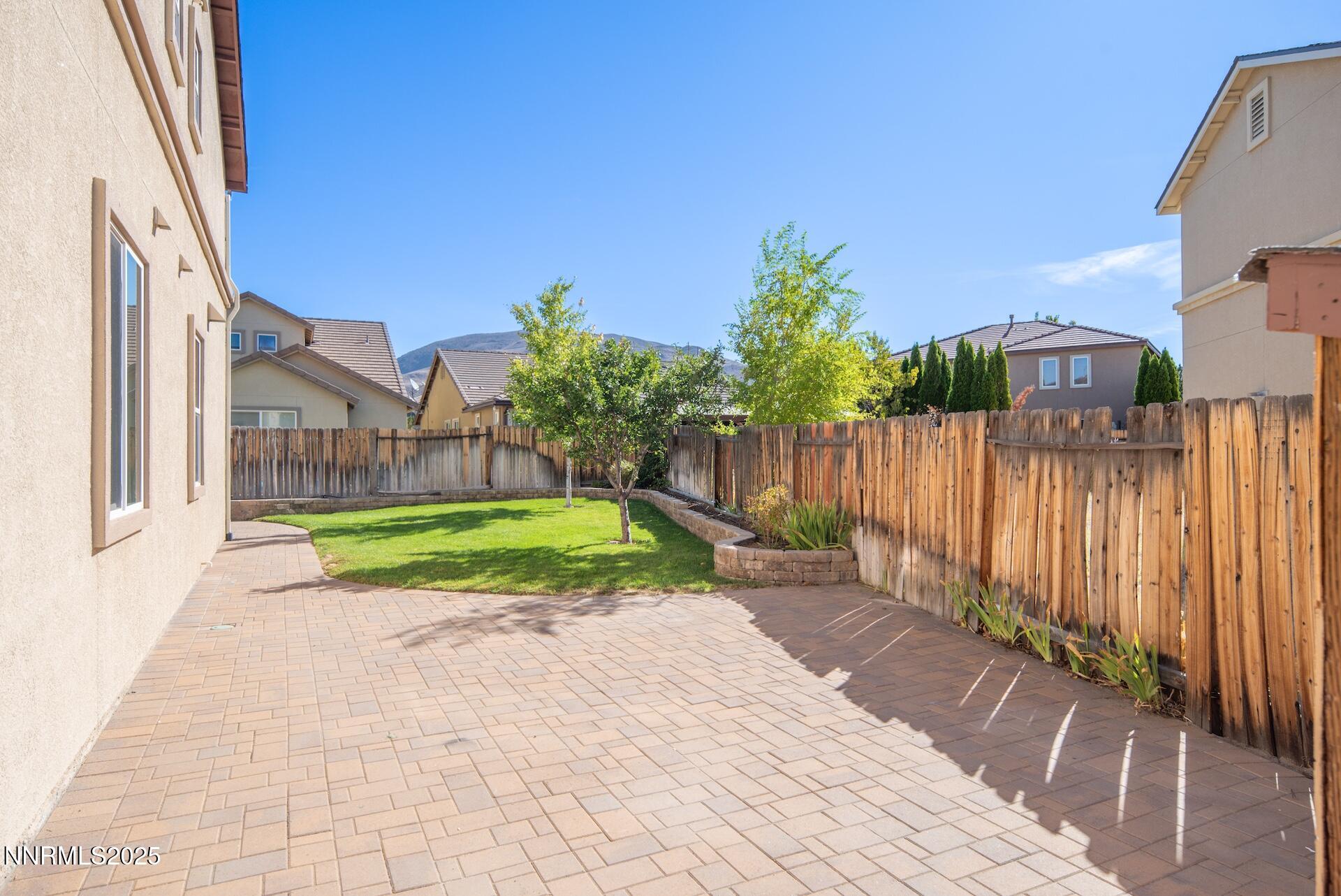 2085 Long Hollow Drive Reno, NV 89521 - Photo 37 of 42 a view of backyard with a garden and wooden fence