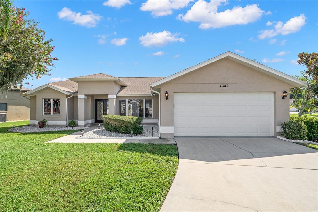 4352 Onorio Street New Port Richey, FL 34653 - Photo 1 of 1 a front view of a house with yard and green space
