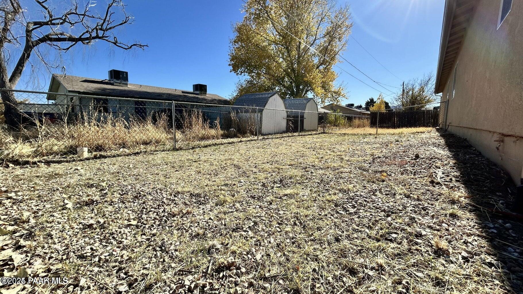 3101 North Corrine Drive, Unit 1 Prescott Valley, AZ 86314 - Photo 15 of 16 a front view of a house with a yard