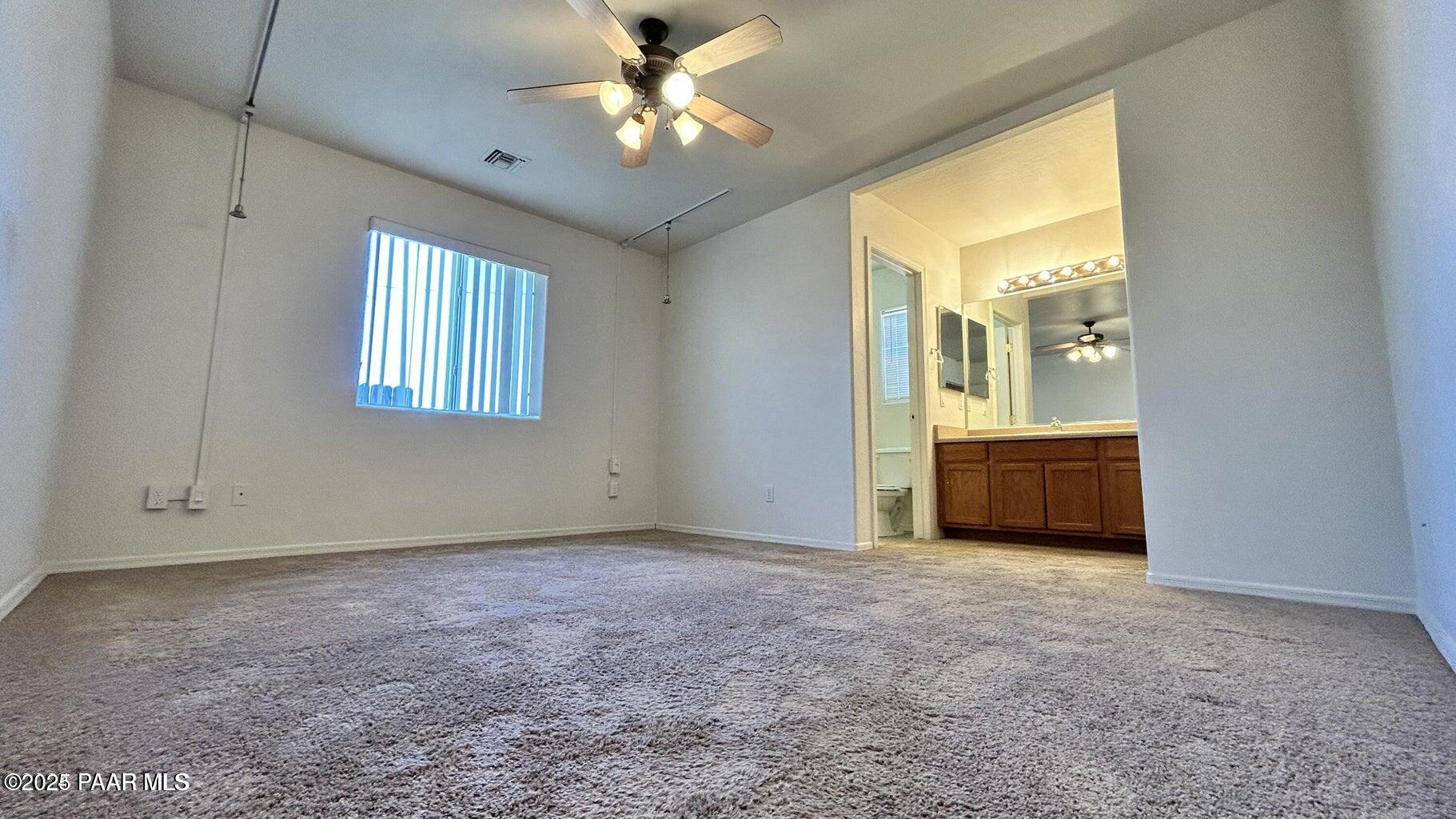 3101 North Corrine Drive, Unit 1 Prescott Valley, AZ 86314 - Photo 5 of 16 a view of an empty room with a window
