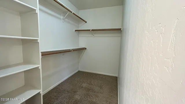 a view of an empty walk in closet