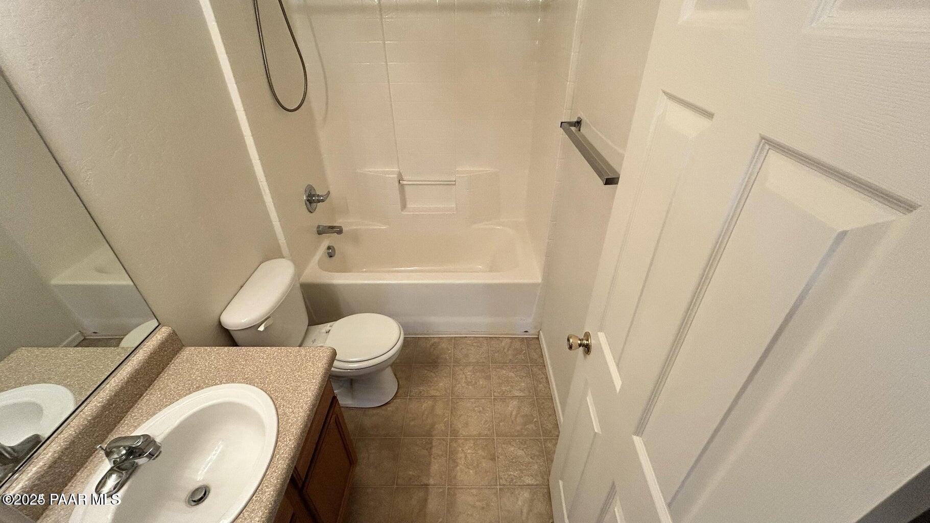 3101 North Corrine Drive, Unit 1 Prescott Valley, AZ 86314 - Photo 10 of 16 a bathroom with a toilet and a shower