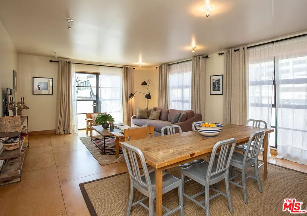 309 South Hamel Road Los Angeles, CA 90048 - Photo 13 of 34 a view of a dining room with furniture window and wooden floor
