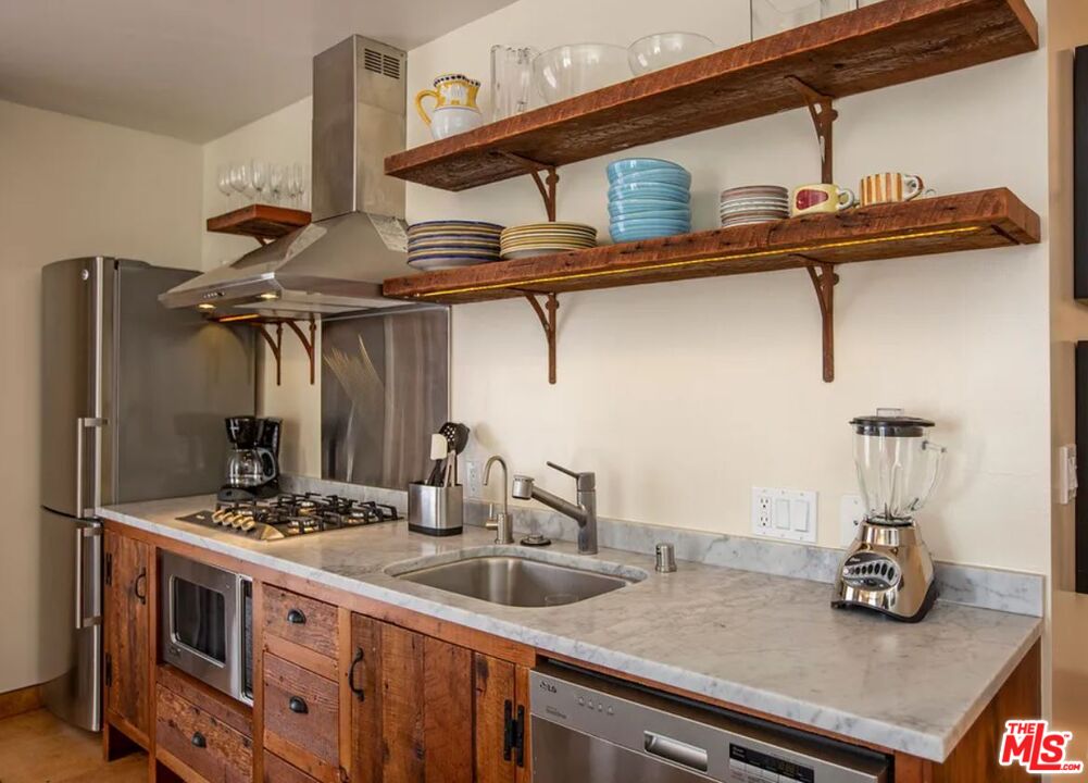 309 South Hamel Road Los Angeles, CA 90048 - Photo 15 of 34 a kitchen with a sink and cabinets