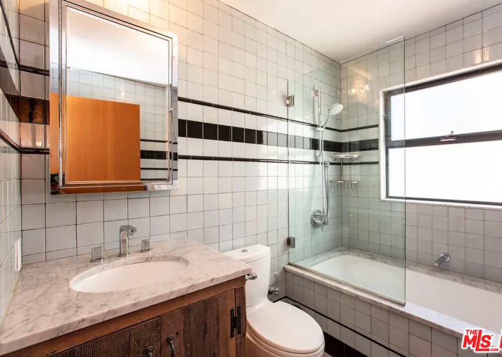 309 South Hamel Road Los Angeles, CA 90048 - Photo 17 of 34 a bathroom with a granite countertop sink toilet and shower