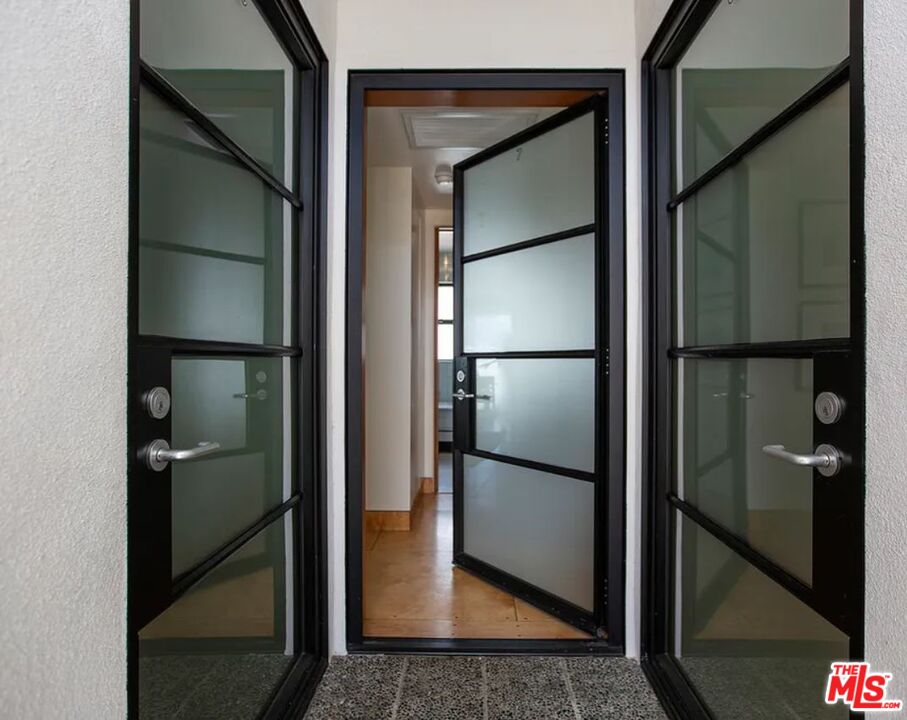 309 South Hamel Road Los Angeles, CA 90048 - Photo 19 of 34 a bathroom with a glass shower door