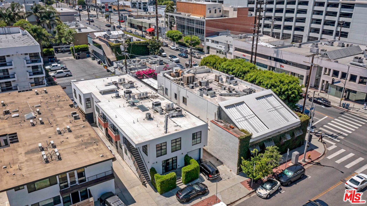309 South Hamel Road Los Angeles, CA 90048 - Photo 27 of 34 an aerial view of a house with a garden and trees
