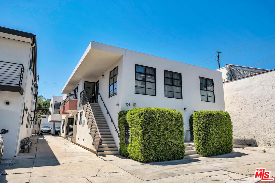 309 South Hamel Road Los Angeles, CA 90048 - Photo 4 of 34 a view of a house with many windows