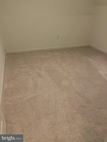 a kitchen with a sink and refrigerator