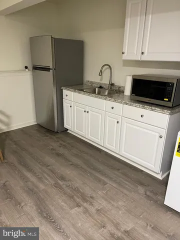 a view of a livingroom with furniture and wooden floor
