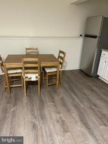 a bathroom with a toilet and a shower curtain