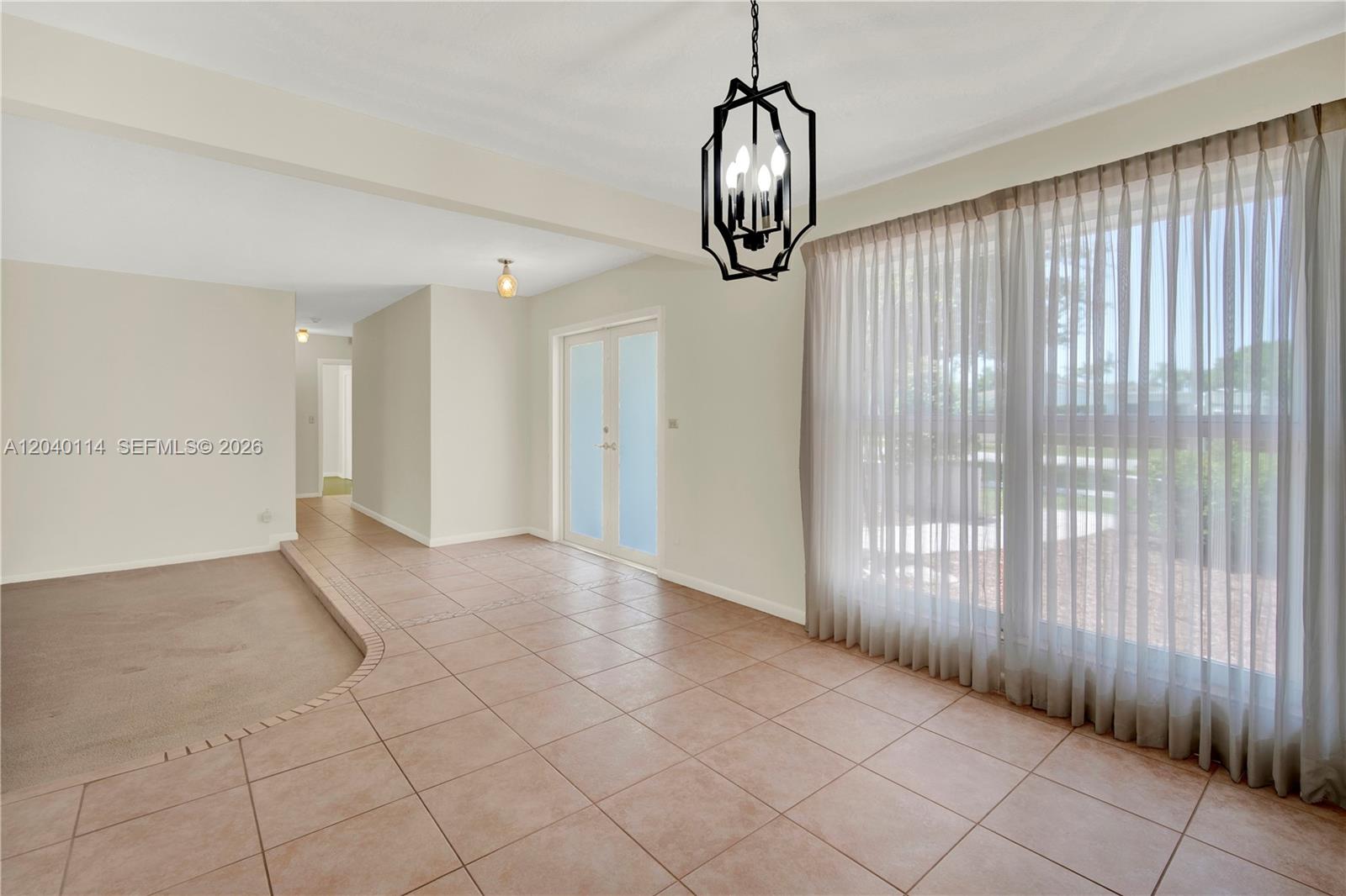 10435 Southwest 96th Street Miami, FL 33176 - Photo 11 of 44 Ceiling to floors windows in the dining room