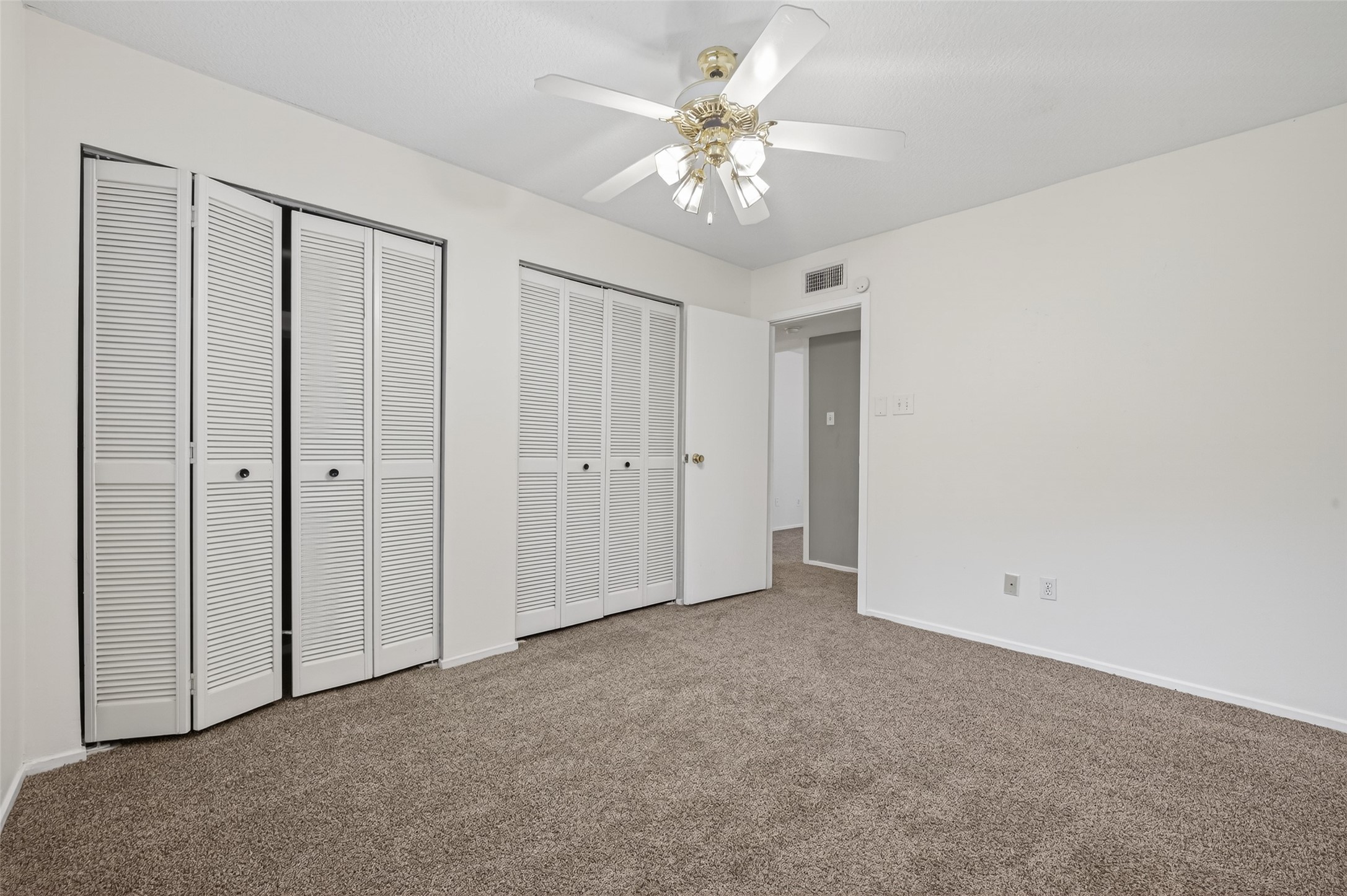 1106 East Red Cedar Circle Spring, TX 77380 - Photo 25 of 43 a view of an empty room with a chandelier fan