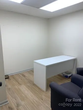 a view of a workspace with furniture