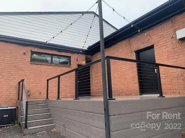 a view of outdoor space with swimming pool and trees